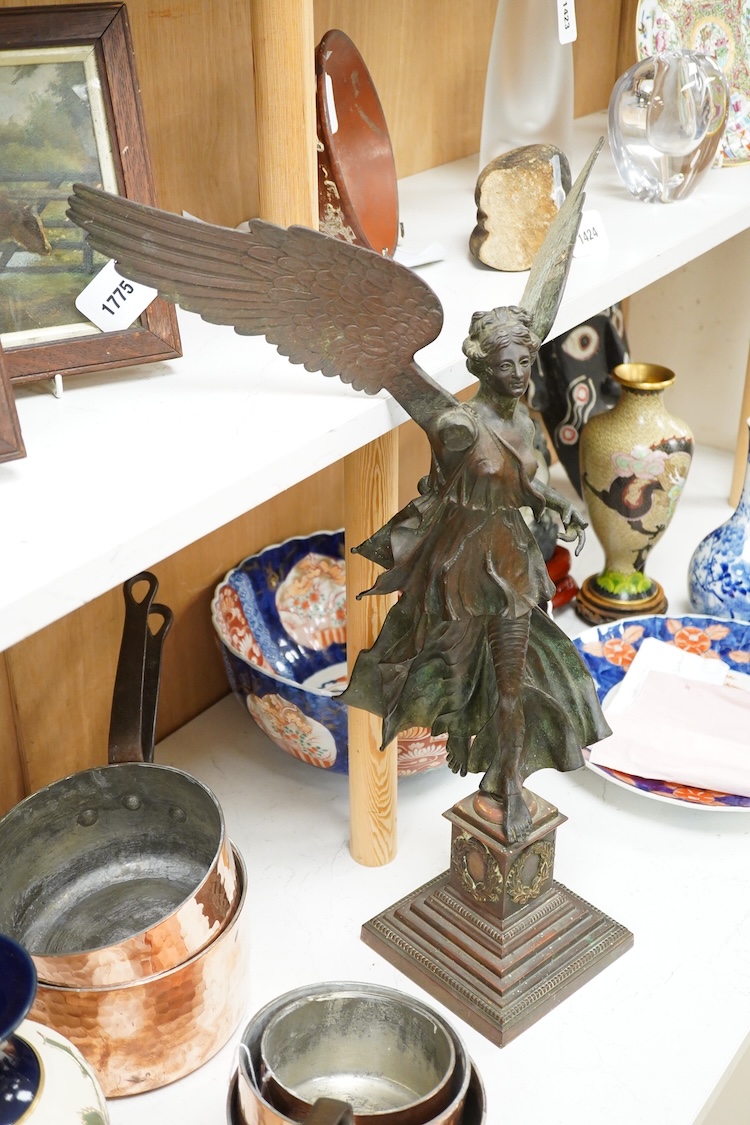 After the antique, an early 20th century bronze figure Winged Victory, on associated base, 60cm high